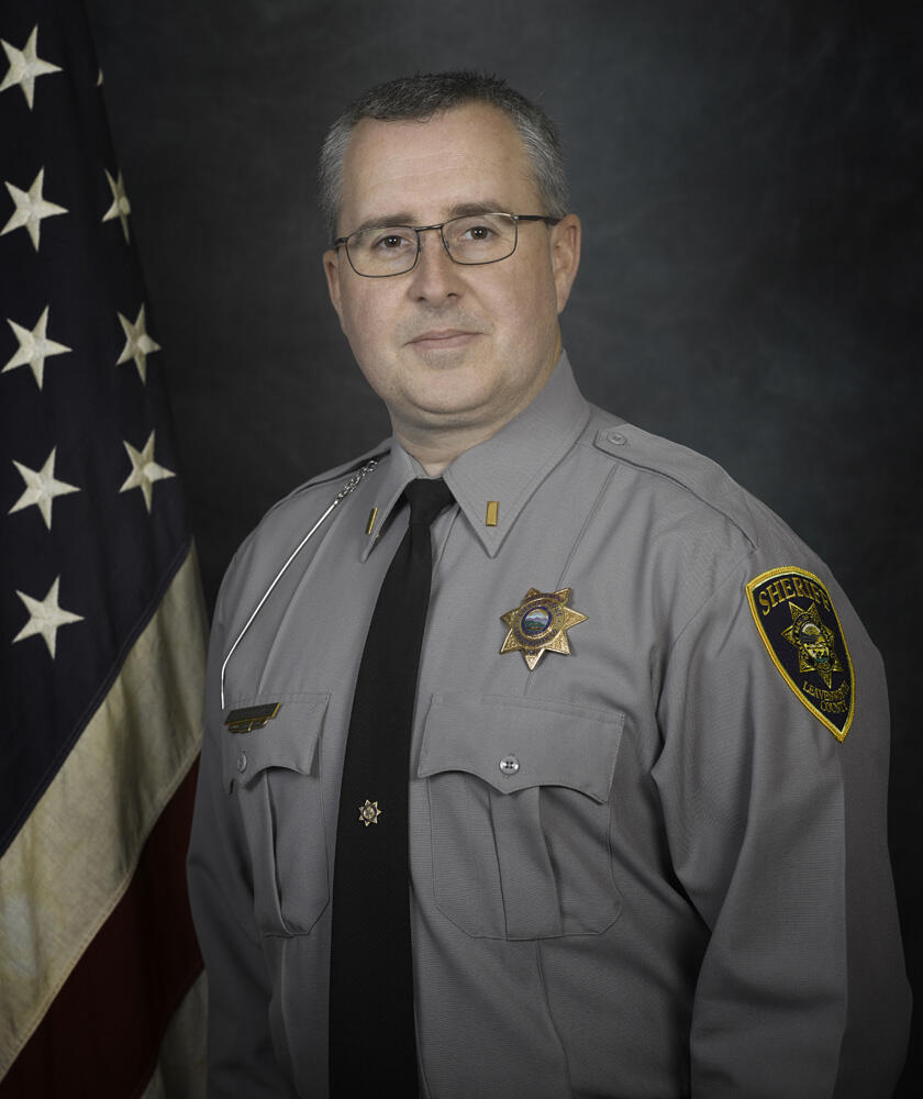 Joshua Patzwald wearing grey Sheriff's Office Uniform