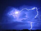 blue stormy sky with a bolt of lightening